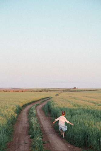 jogging Girl running down a country road