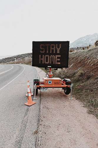 breathing road sign with stay home phrase