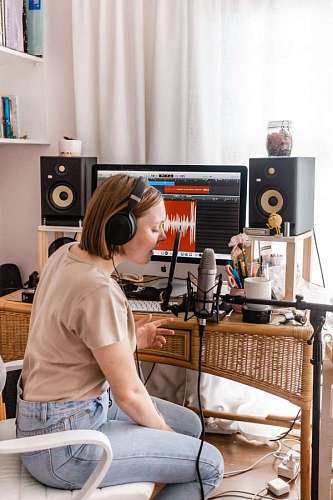 homework Young woman singing working from home