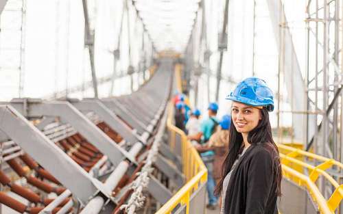 hardhat Close-up of a woman with safety helmet on a construction site