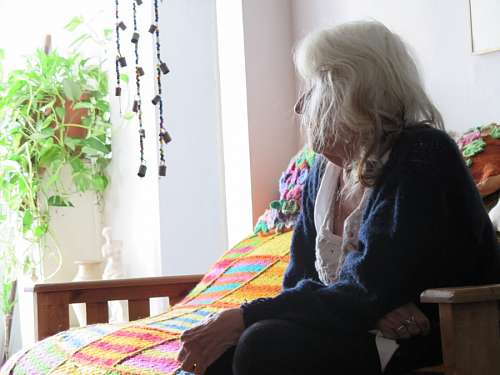 80s Old woman watching tv
