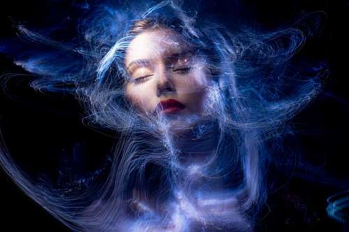 Futuristic portrait of a woman dreaming with her eyes closed
