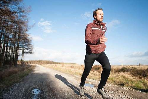 man running on an old road