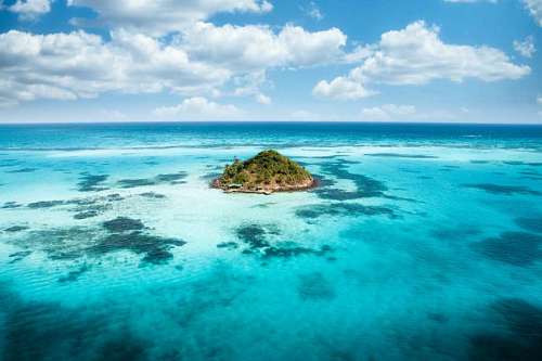 Lonely tropical island in the turquoise sea