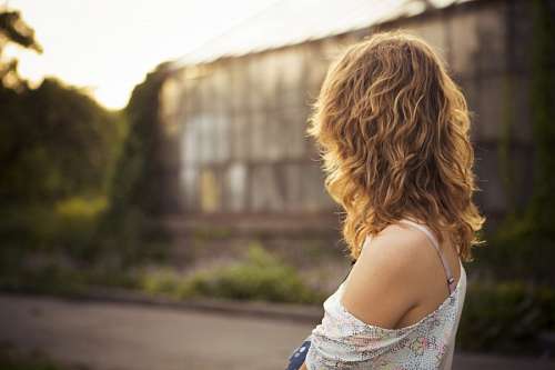 looking-over-shoulder Woman at sunset