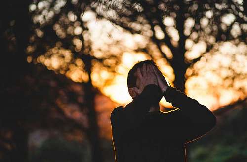 Sad man at sunset