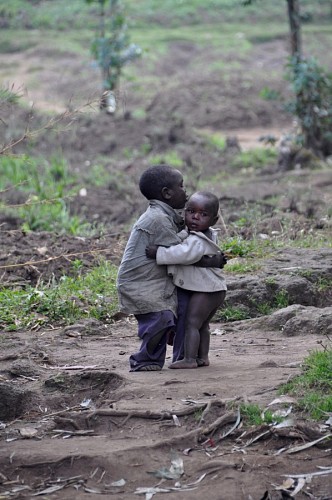 help African children giving a hug