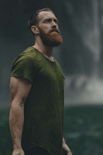 Adult man with red beard with confident look