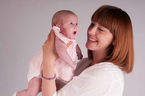  Mother holding her little daughter