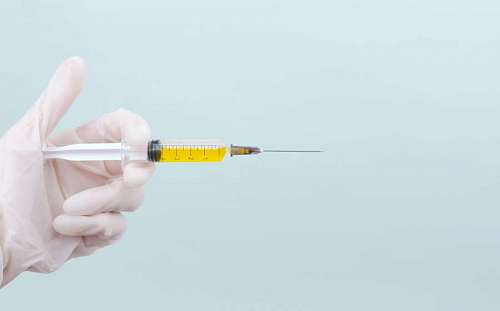 Doctor with syringe