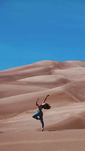 woman dancing in the desert