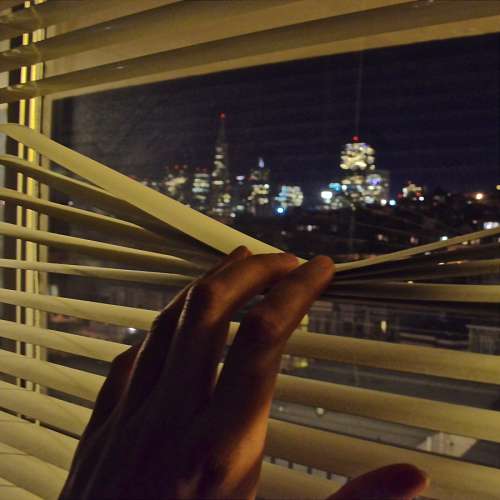 hover Man looking through a window 