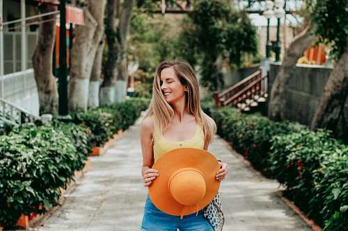 Young woman with hat smiling