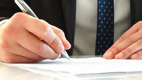 Man signs a contract