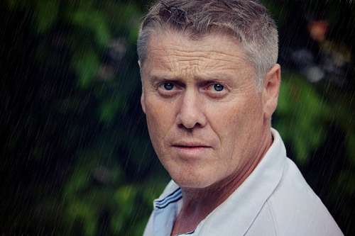 Adult man looking at camera
