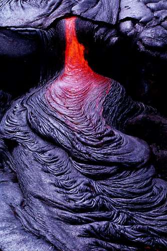 closeup of a small river of lava cooling