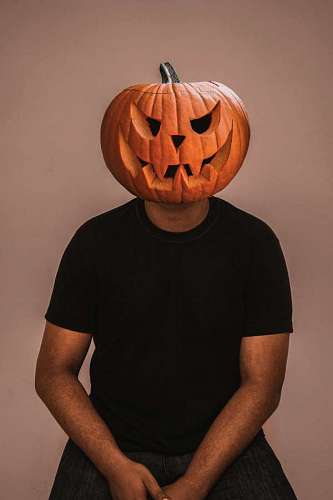Man with pumpkin on his head on Halloween