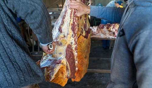 part-of  Men Working in a Rural Butcher Shop