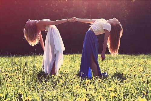 Women in forest at sunset