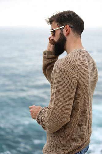 Young sexy man in front of the sea