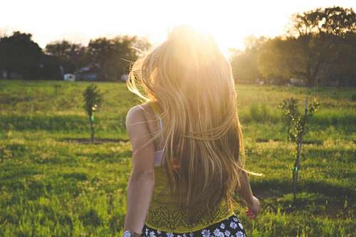 woman enjoying the field while in the sun