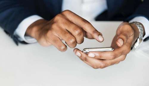 Businessman using his phone
