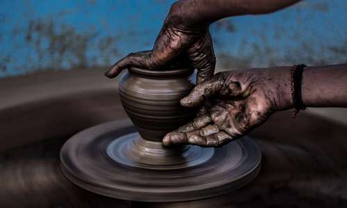 artisanal-coffee close-up of a person making clay pots