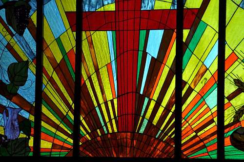 Stained glass cross in a church