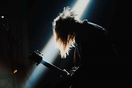 Man playing guitar at a rock concert