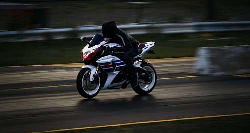 A person driving a sports motorcycle on the road