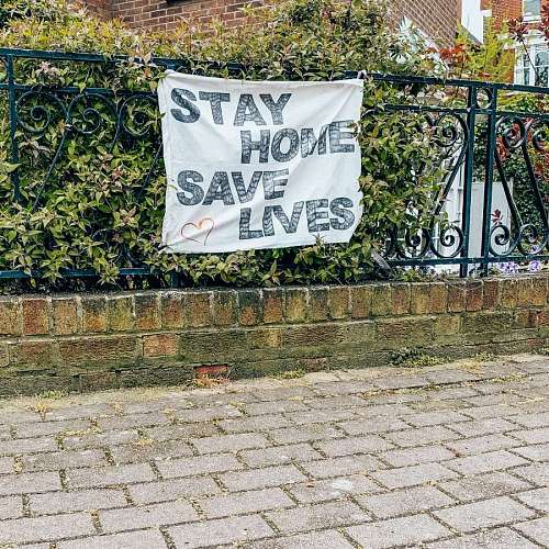 savings poster with phrase stay home and save lives