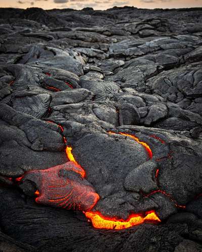 change closeup of a river of lava cooling