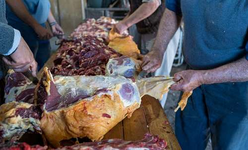 part-of  People working in a butcher shop