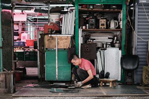 Asian man working in his workshop
