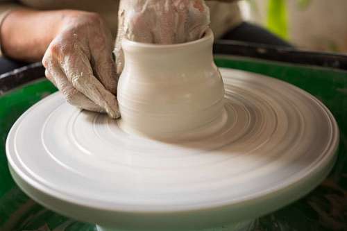 mold Woman making pottery with lathe