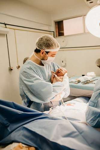 newborn surgeon holding a newborn