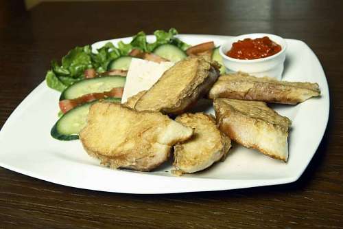 Egg in bread with salad for breakfast.