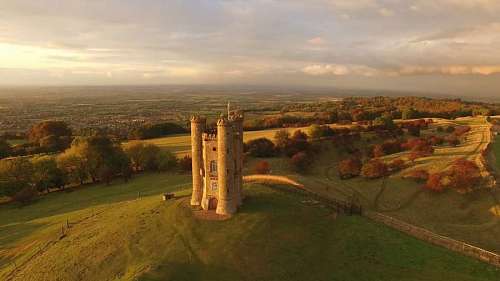 palace aerial view of a castle in the middle of a beautiful country landscape