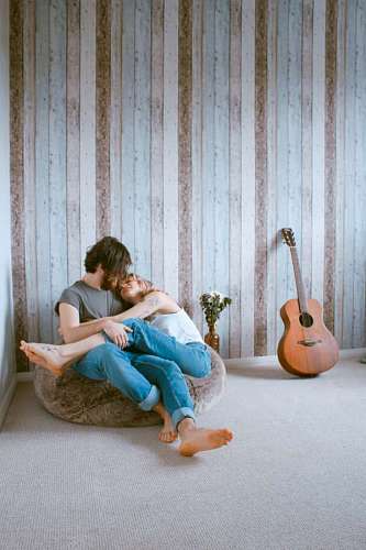 Couple of lovers in the embraced living room