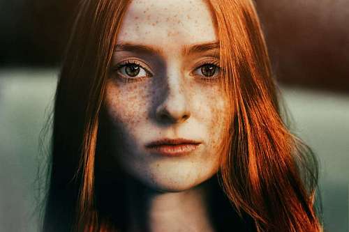 robe Portrait of a red-haired woman looking at the camera