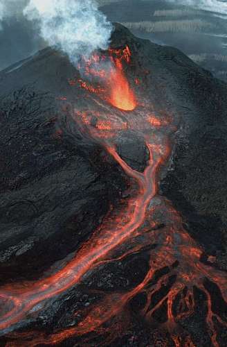 change aerial view of a volcano expelling lava