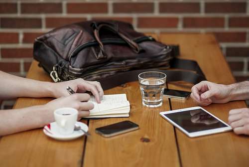 Two business people in a cafe