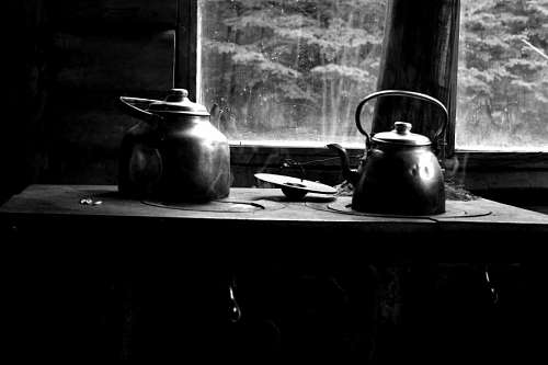 boys Pot with hot water on rustic kitchen