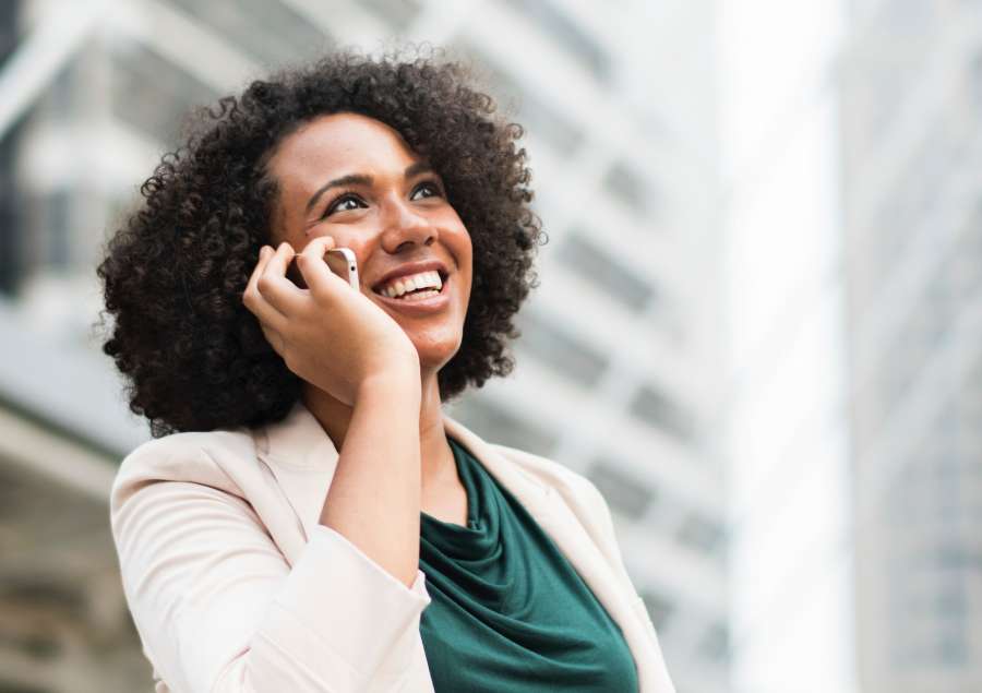 woman, one person, adult, smile, smiling, communication, smartphone, phone, cell, exterior, business, work, face, joy, urban, elegant, curlers,
