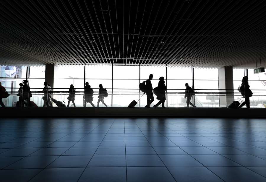 airport, indoors, people, silhouette, reflection, commuter, shadow, luggage, business, adult, city, station, horizontal, color image, subway, transportation, airport departure area, transportation building - type of building, built structure, women, light - natural phenomenon, professional occupation, only women, travel, business travel, passenger, adults only