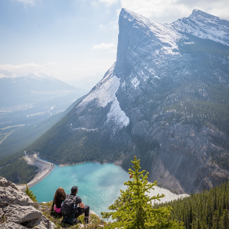 Couple mountain lagoon vacation climber peak nature two explorer vacation adventure sitting hiking,