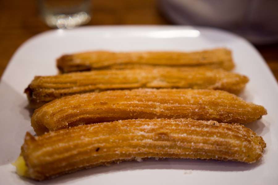 fried, sweet, delicious, dessert, churros, pastry, food, cuisine, breakfast, churro, spanish, plate, sugar, bakery, dough, spain, white, meal, snack, cooking, chocolate, tasty, table, traditional, homemade, stick, donut, gastronomy, background, mexican, fritter, sauce, eat, cinnamon, brown, nutrition, portuguese, culture, closeup, baked, latin, cup, crunchy, street, dish, biscuit, light, roasted, hot, french
