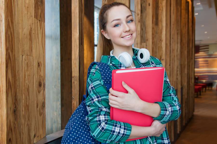 students university,young girl college intern,student,white background,background,casual,folders,holding,posing,student,white,academic,academicals,library