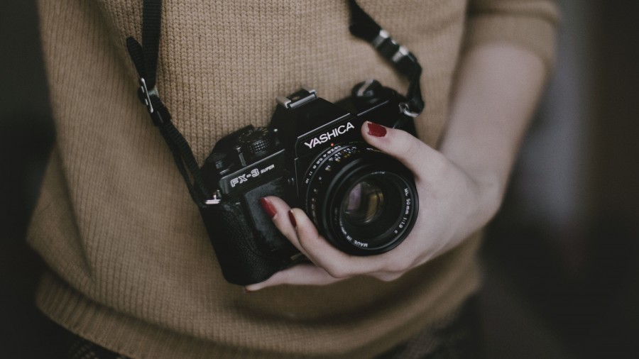 one person, people, woman, camera, photography, photographer, foreground, sweater, brown, yashica lens,