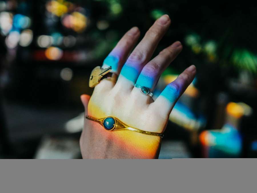 Hand, Light, Rainbow, Ring, Mood Ring, Purple, Blue, Red, Orange, Yellow, Color, Key, bokeh, nails 
